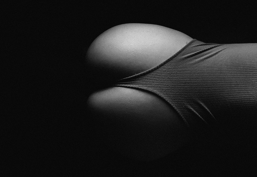 black and white photo of woman bum